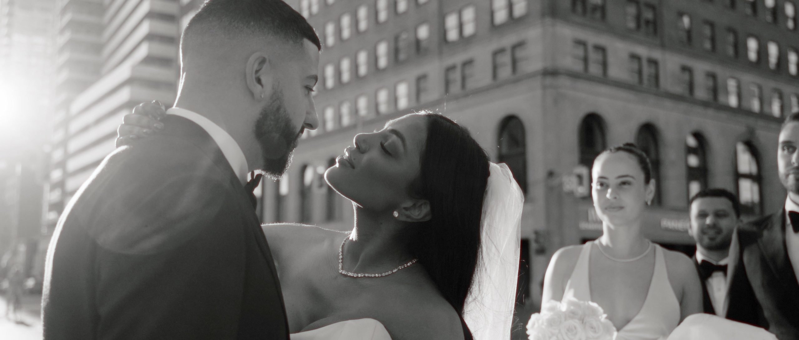 Wedding Films 1 couple kiss on the streets of Toronto during their wedding